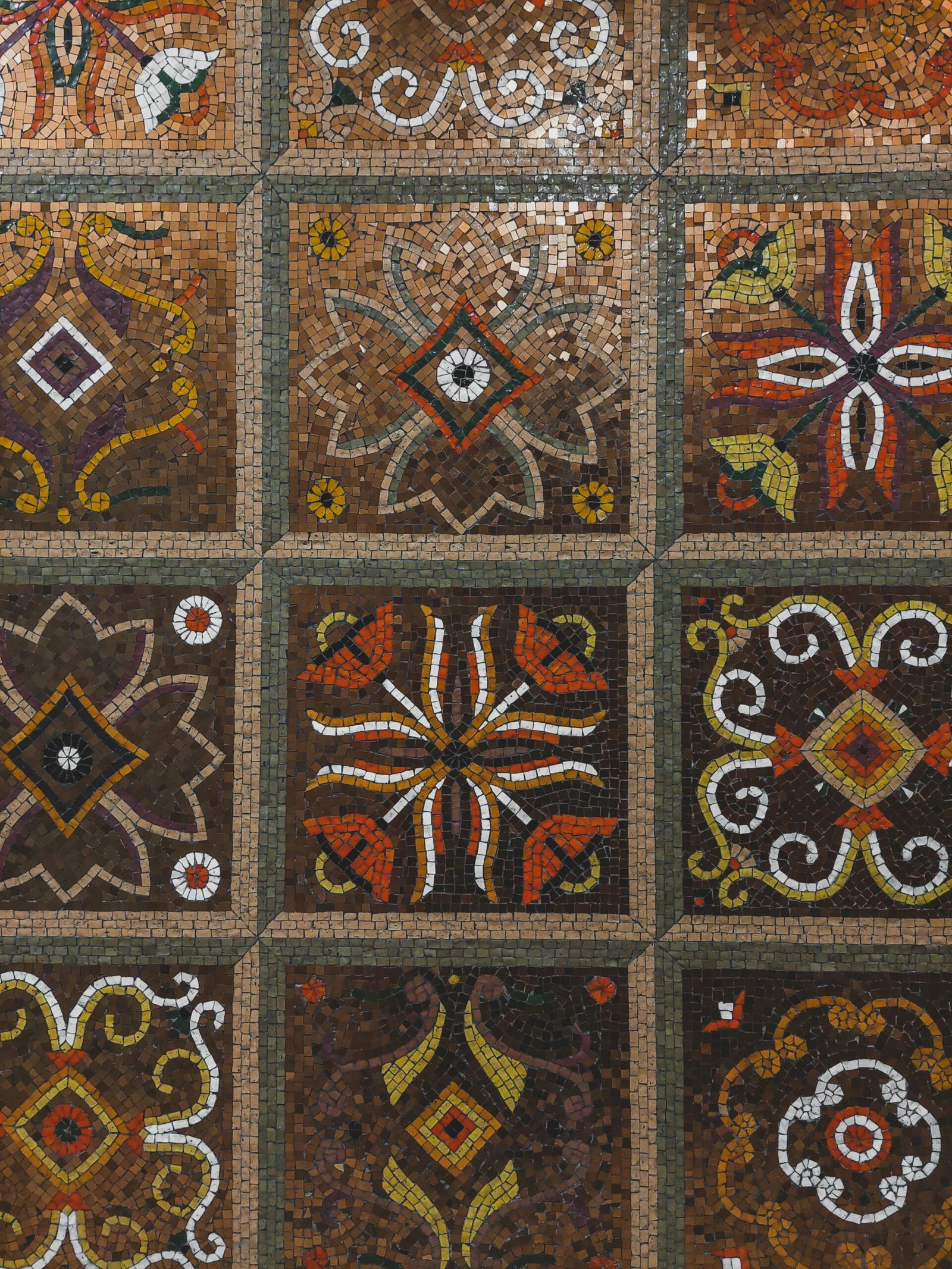 Detailed mosaic pattern with colorful geometric and floral motifs.